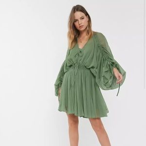 Green ASOS mini dress with unique sleeves